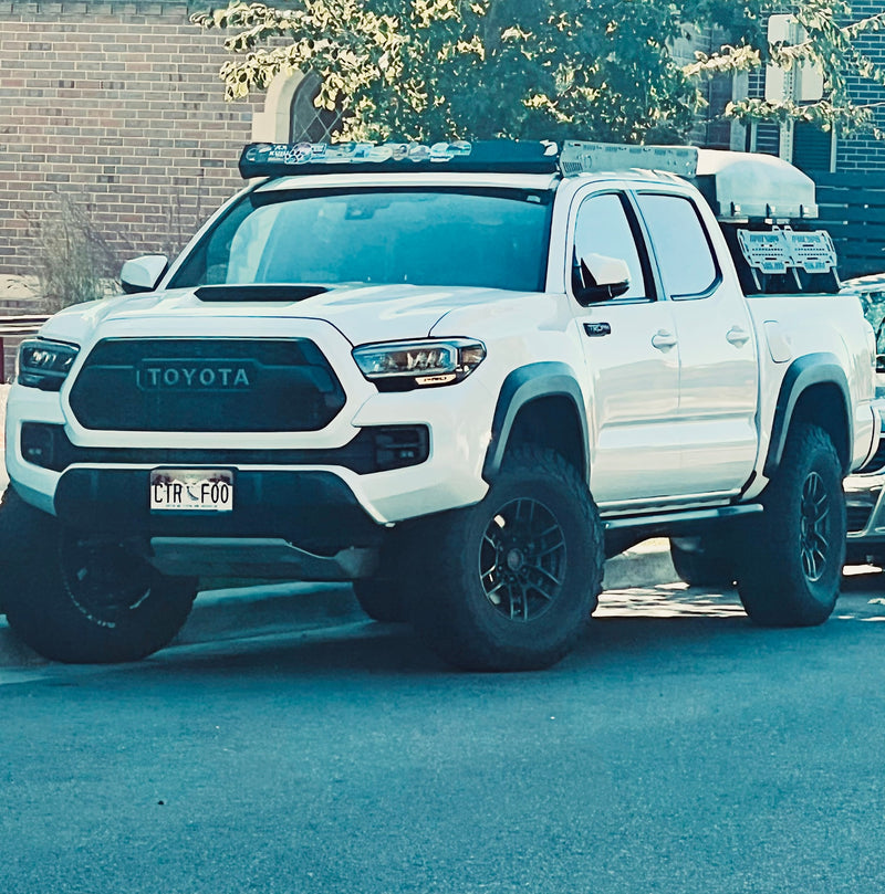White Toyota Tacoma truck equipped for overlanding & adventure. An alternative to an RV rental for outdoor explorers. — photo 4