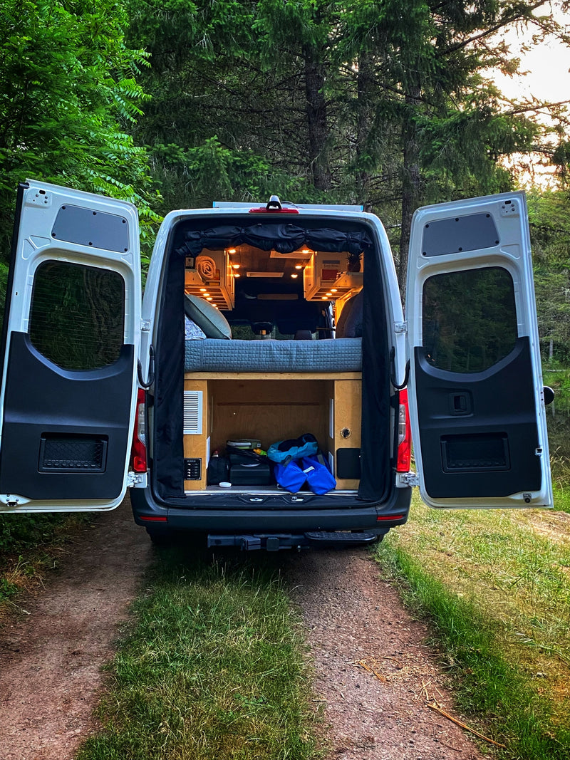  and dining area.|This RV rental features a pull-out composting toilet in a blue cabinet — photo 7