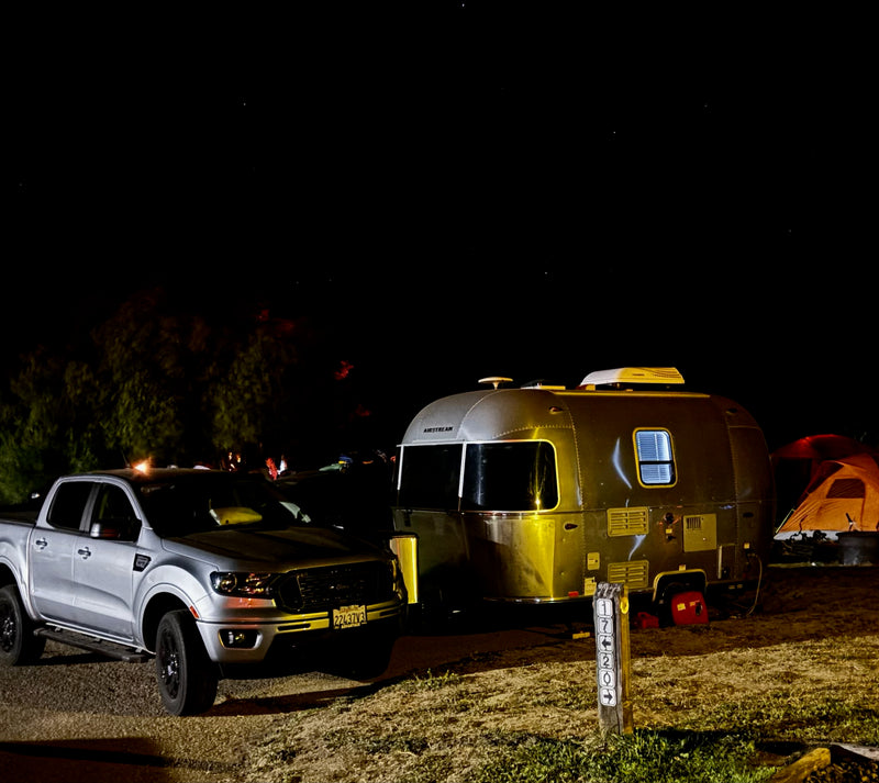 Night camping scene with an Airstream RV rental — photo 1