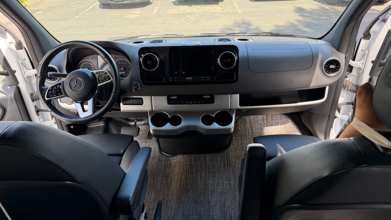  and overhead AC unit. Sunlit sleeping area.|RV rental with side door open — photo 7
