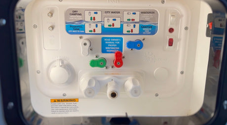RV rental water system control panel: dry camping, city water, tank fill, winterize, sanitize, pump, and utility connections.