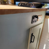 RV rental interior: A wooden counter, portable electric stove, and essential USB/power outlets for convenience.