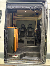 Inside an rv rental camper van: comfortable seating, compact kitchenette, and smart storage solutions for mobile adventures.