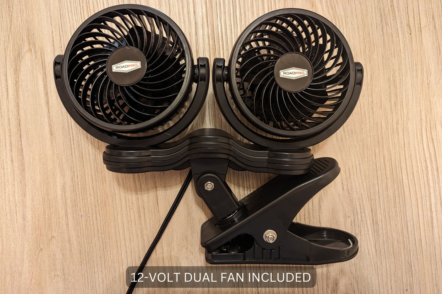 Stay cool in your RV rental with this 12-volt dual fan! Black, clip-on design, perfect for travel comfort.