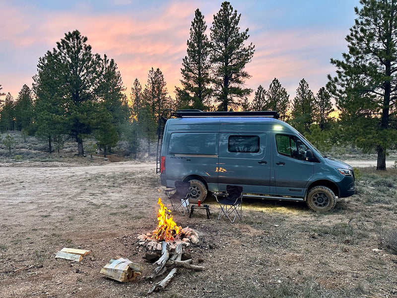  chairs set out.|Experience freedom with an rv rental! Blue camper van overlooks a vast field & stunning red rock|Mercedes Sprinter RV rental van — photo 2