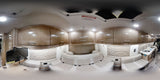 Panoramic view of a modern **rv rental** interior, featuring light wood cabinets, comfortable seating, and a compact kitchen.