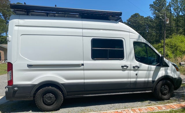This white Ford Transit camper van is an ideal RV rental for your next adventure.