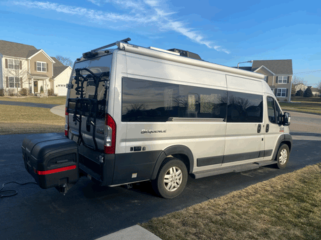 This RV rental Thor Sequence camper van is equipped with a bike rack, rear storage, and roof awning, ready for adventure.