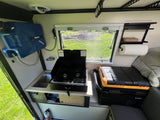 This RV rental features a compact kitchen with a Dometic stove, sink, Lifesaver water tank, and a BougeRV fridge.