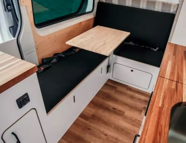  open doors show interior kitchenette. Parked on sand — photo 4