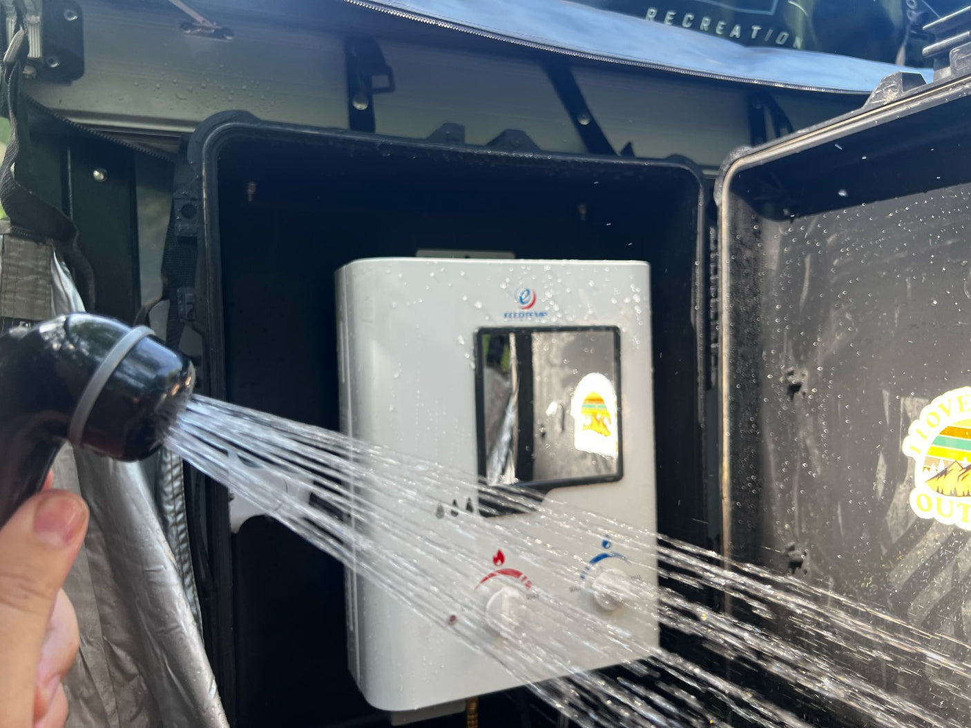 Portable hot water setup for your RV rental adventure. Enjoy an outdoor shower with this camper-friendly heater.
