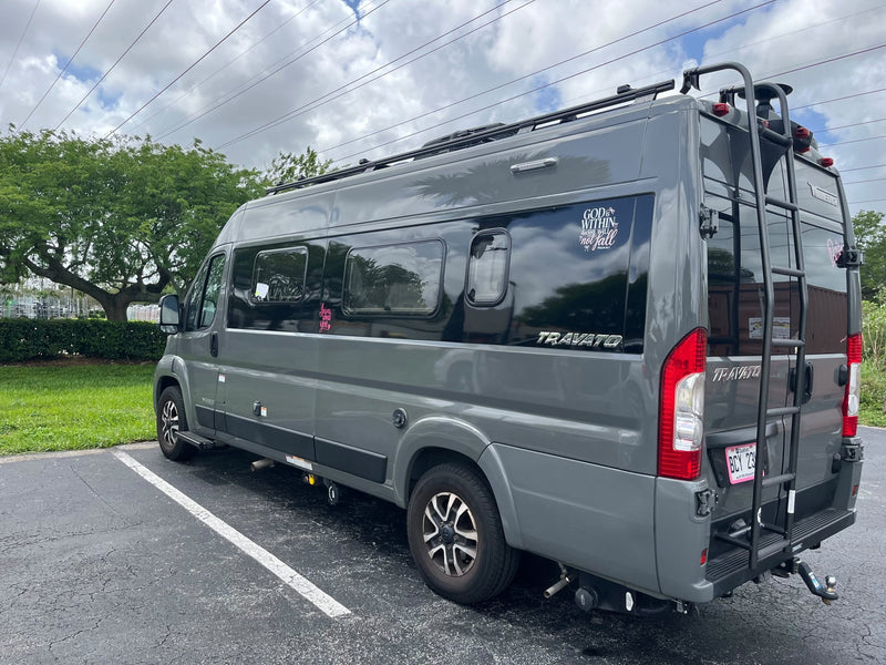  perfect for your next RV rental. Front view shows 'Blessed' license plate & sunny outdoor setting.|This gray Winnebago Travato RV rental — photo 2