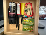 RV rental drawer: pepper gel, bear spray, waterproof matches, and Nite Ize carabiners for outdoor safety.