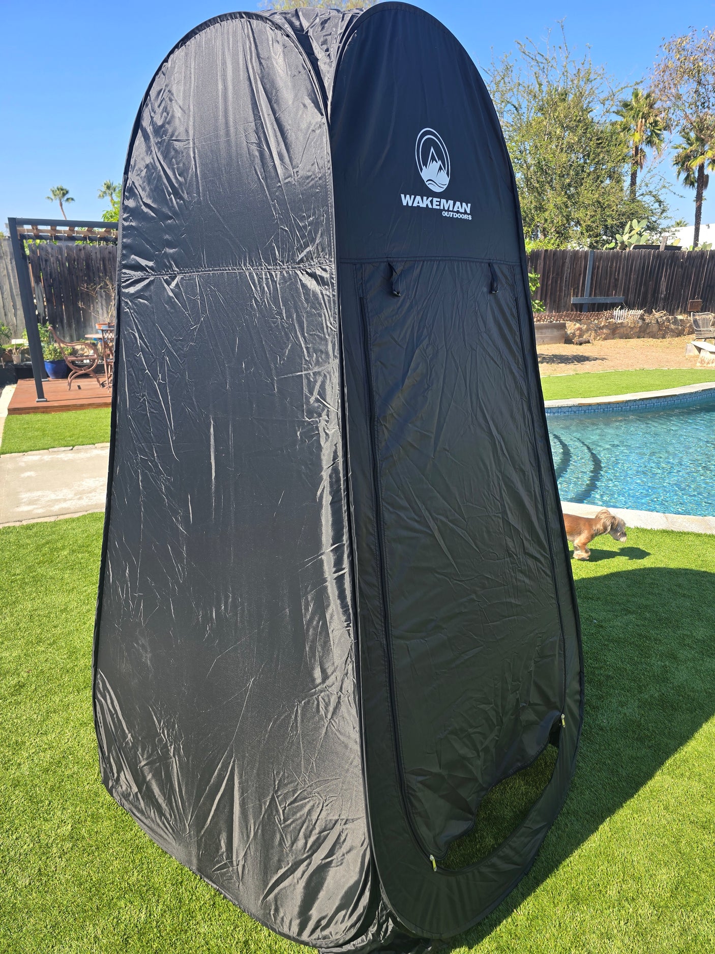 Black portable Wakeman Outdoors privacy tent, ideal for RV rental, camping, or poolside changing/showering.