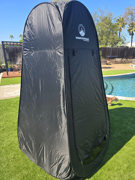 Black portable Wakeman Outdoors privacy tent, ideal for RV rental, camping, or poolside changing/showering.
