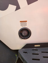 An RV rental's fresh water inlet with a warning about potable water and tank maintenance. Essential safety info.