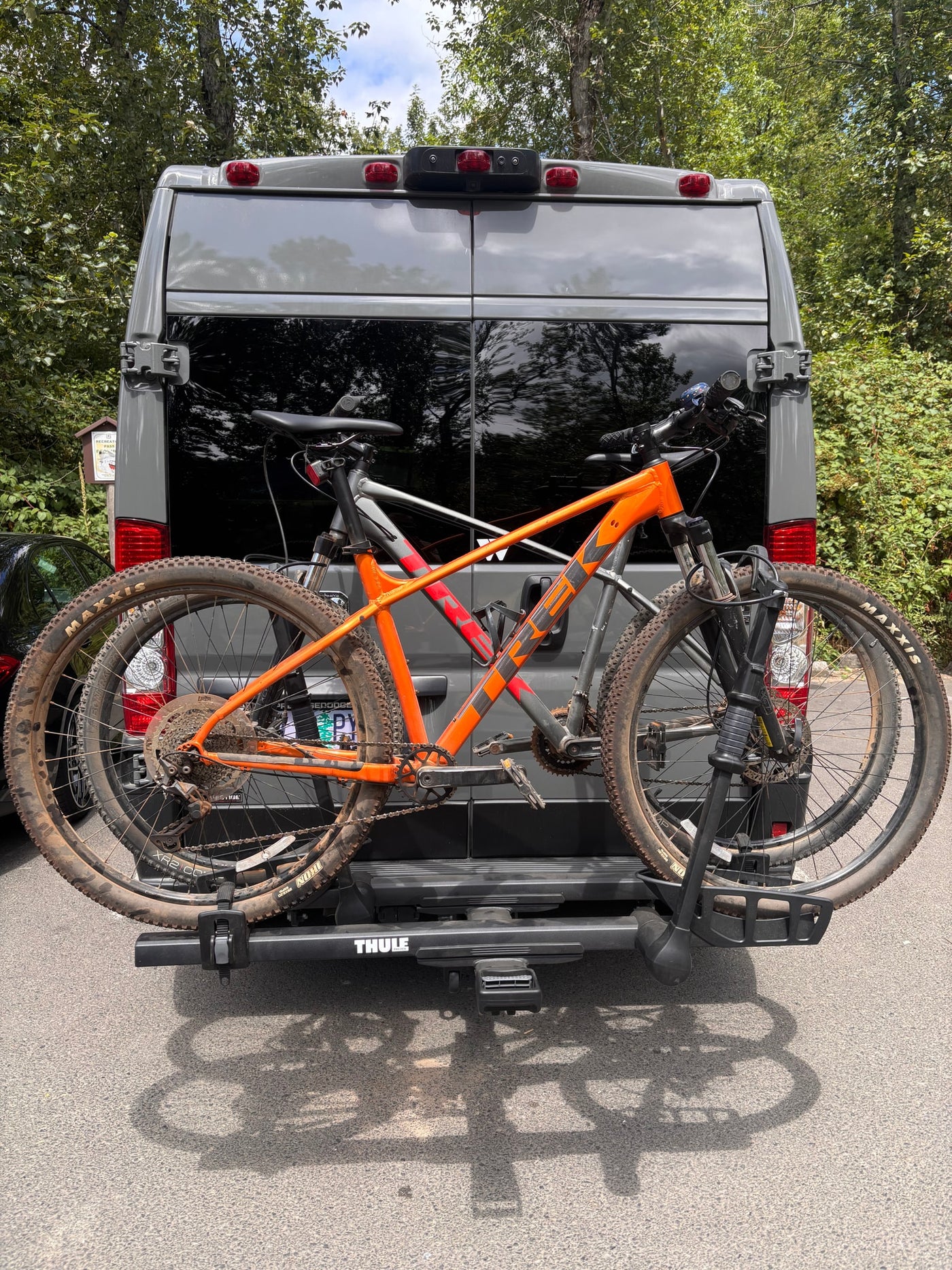 Grey RV rental van with two mountain bikes mounted on a rear Thule rack, ready for outdoor trails. — photo 8