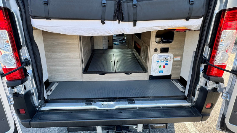  a comfy pop-top bed features two sleeping bags and pillows — photo 15