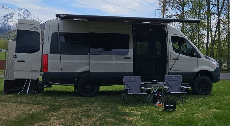  parked on a riverbank with mountains — photo 3
