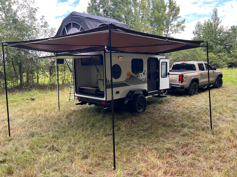 An off-road teardrop trailer with an open galley and rooftop tent, pulled by a pickup, ideal for an rv rental outdoor adventure. — photo 10