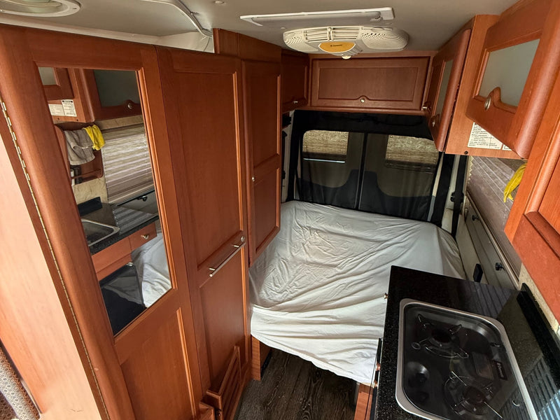  and the driver's seat. Ready for adventures!|RV rental camper van interior showing the driver's cockpit — photo 14