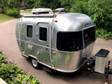 This shiny Airstream Sport travel trailer, equipped with a Dometic AC, is perfect for your next RV rental and outdoor adventure.