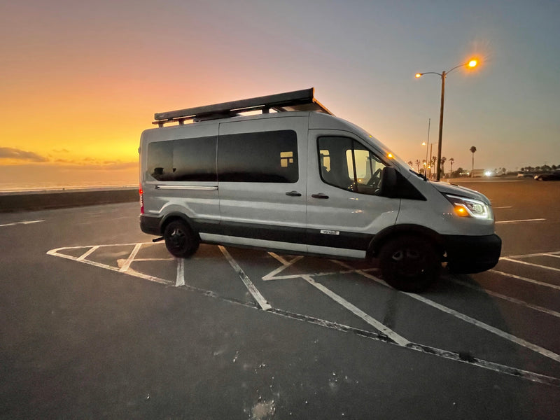 Stunning sunset scene with an RV rental parked by the ocean, ready for adventure and coastal travel. — photo 17