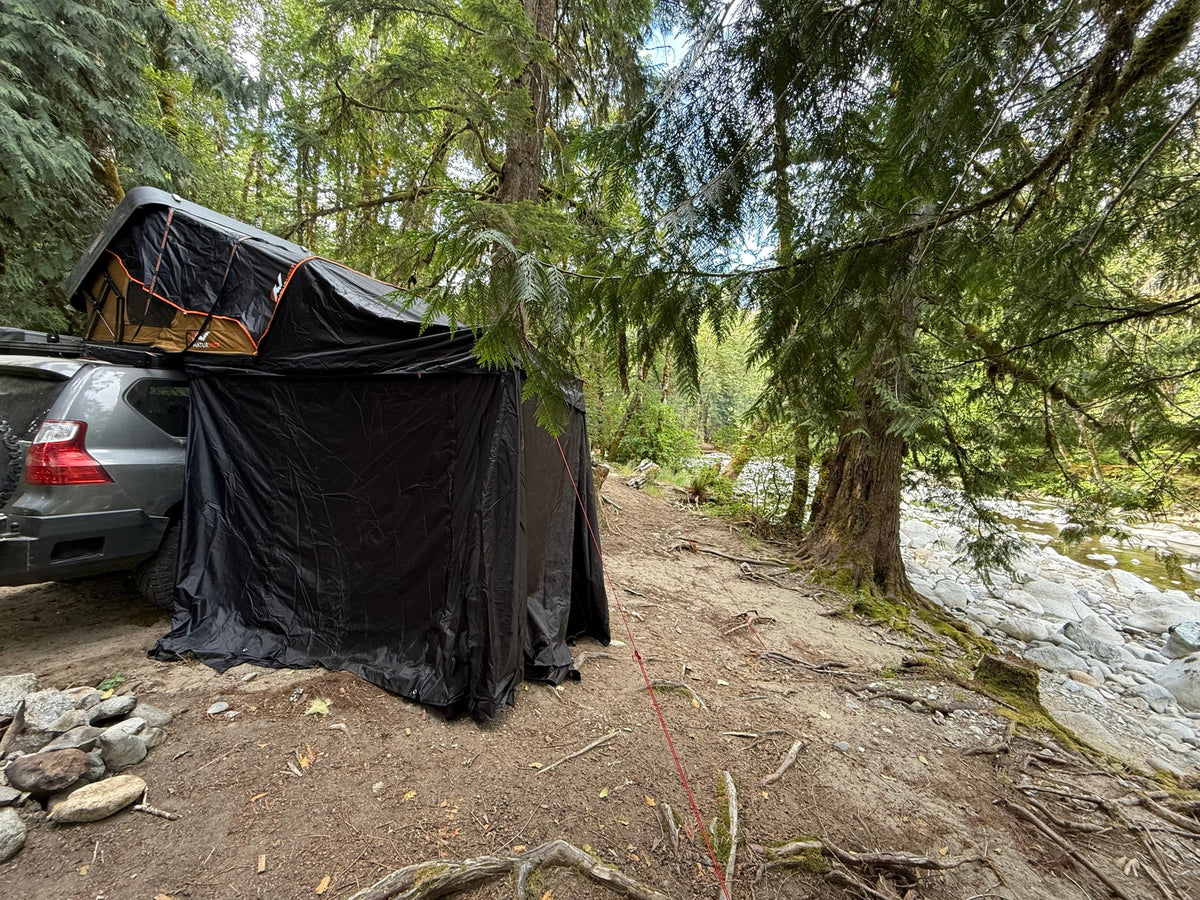  and awning setup. A unique outdoor rv rental adventure.|RV rental: SUV with rooftop tent & privacy room — photo 7