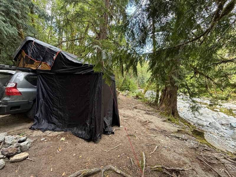  and awning setup. A unique outdoor rv rental adventure.|RV rental: SUV with rooftop tent & privacy room — photo 7