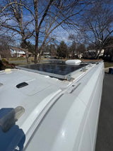 This RV rental features roof-mounted solar panels & vents, ideal for sustainable adventures and off-grid power.