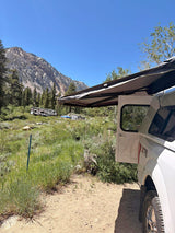  ready for adventure. Explore nature with an RV rental!|Mountain camping adventure! White truck