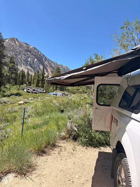  ready for adventure. Explore nature with an RV rental!|Mountain camping adventure! White truck