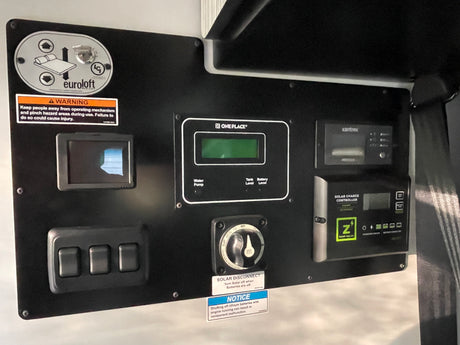 RV rental control panel: Euroloft bed lift, water/battery monitoring, Xantrex inverter, and Zamp solar controller.