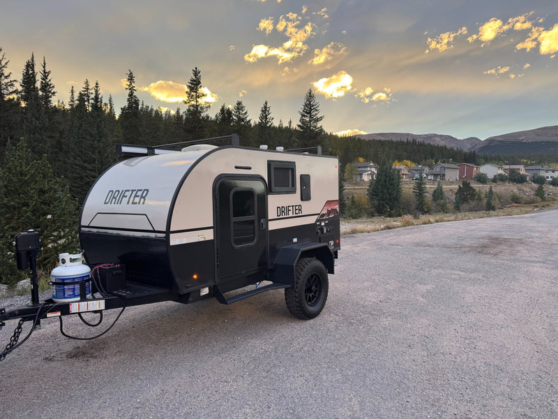 An off-road Drifter RV rental is parked at sunset — photo 1
