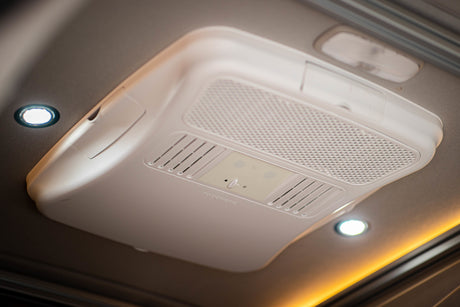 Ensure comfort in your RV rental: Dometic ceiling air conditioning unit with integrated lighting.