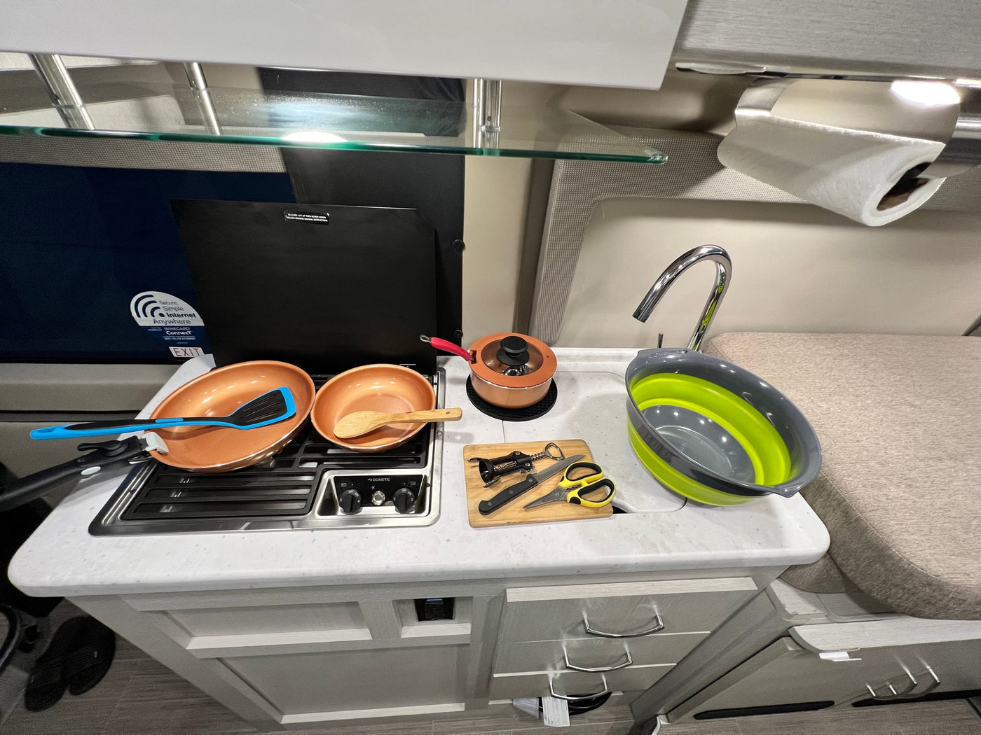  and a beautiful sunset view.|Inside a well-equipped rv rental: kitchenette — photo 11