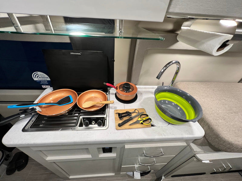  and a beautiful sunset view.|Inside a well-equipped rv rental: kitchenette — photo 11