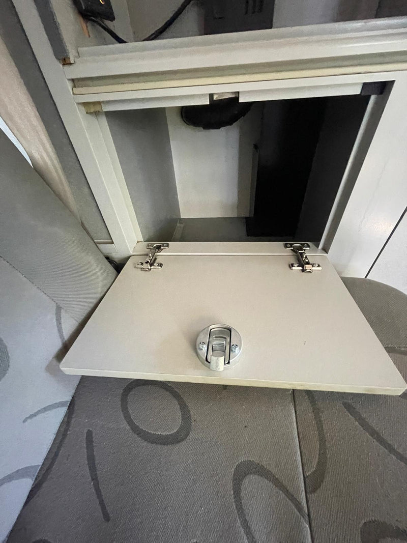  and a rear bike rack.|Inside an RV rental's organized cabinet: cast iron pan — photo 6