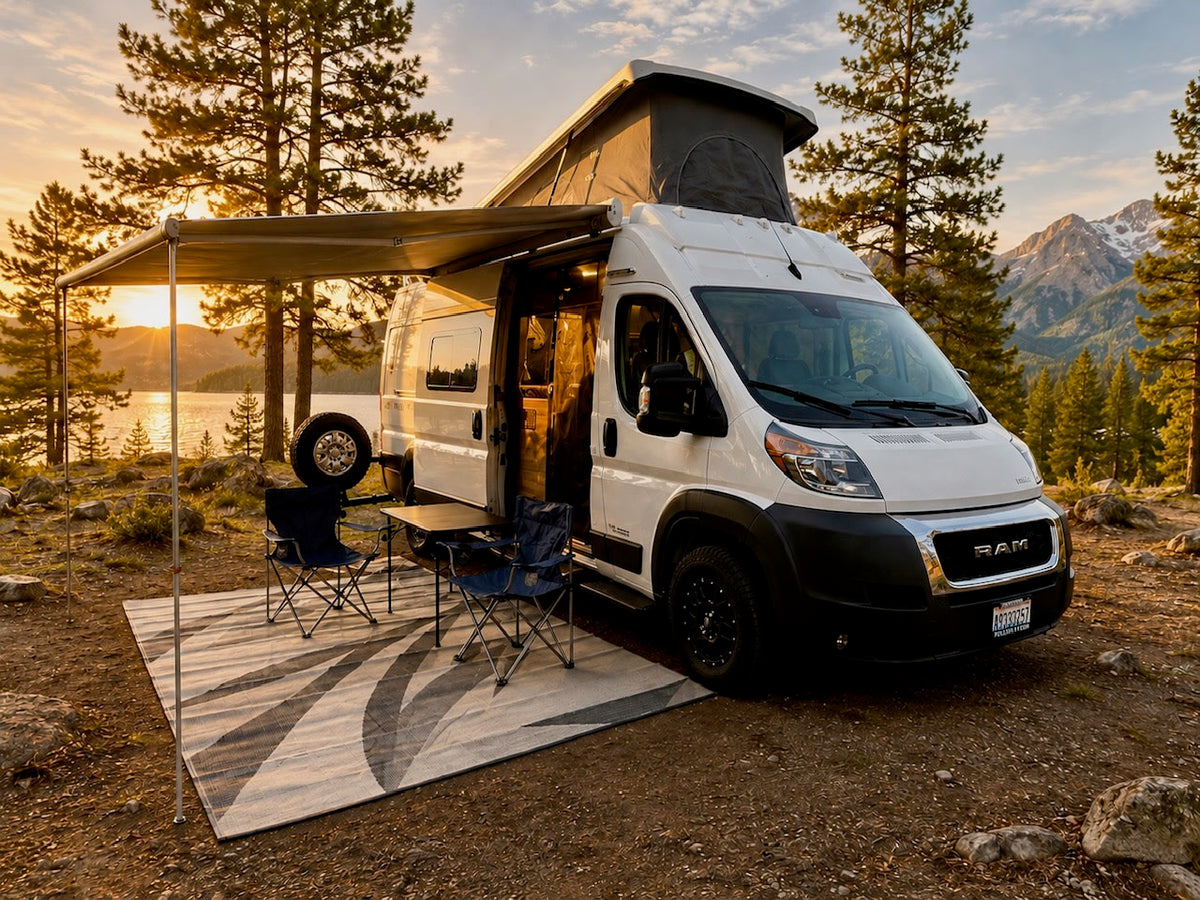 Perfect RV rental for nature lovers! White campervan under awning by a serene lake and mountains at golden hour.|White camper van (Solis RV rental) in a scenic mountain-lake setting at sunset. Ideal for your next outdoor adventure.|Cozy rv rental interior with a plush