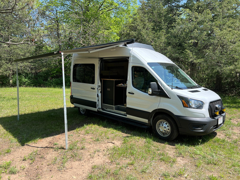  perfect for outdoor camping.|White camper van RV rental parked in a sunny — photo 2