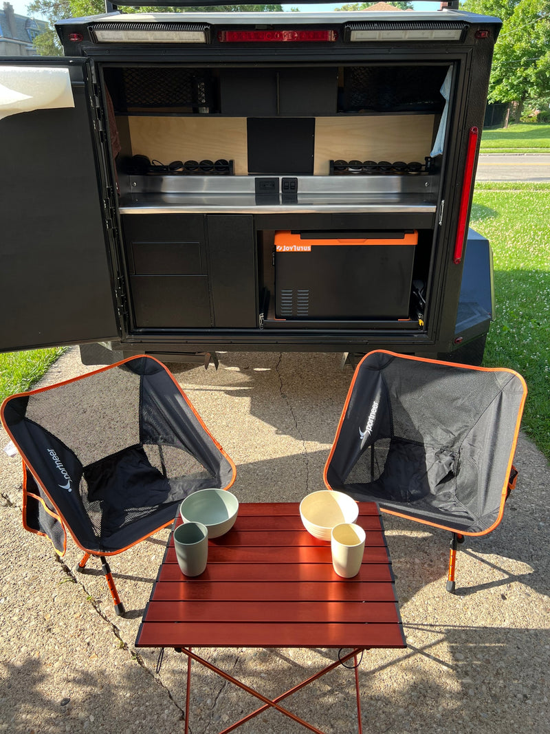  and stainless steel counter.|Functional outdoor kitchen setup in an RV rental — photo 12