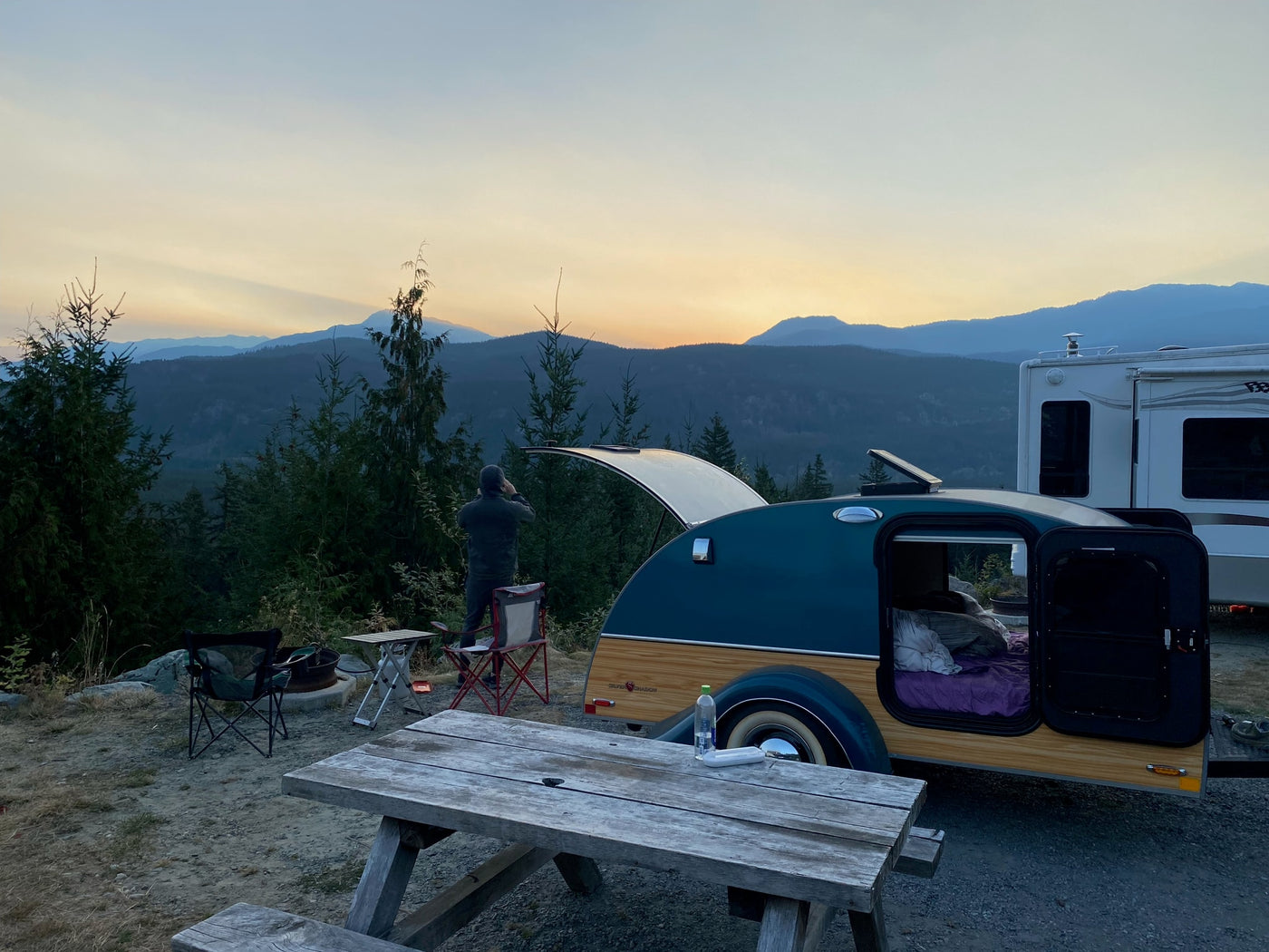  perfect for compact camping.|Experience comfort in this RV rental! Features include a cozy bed — photo 9