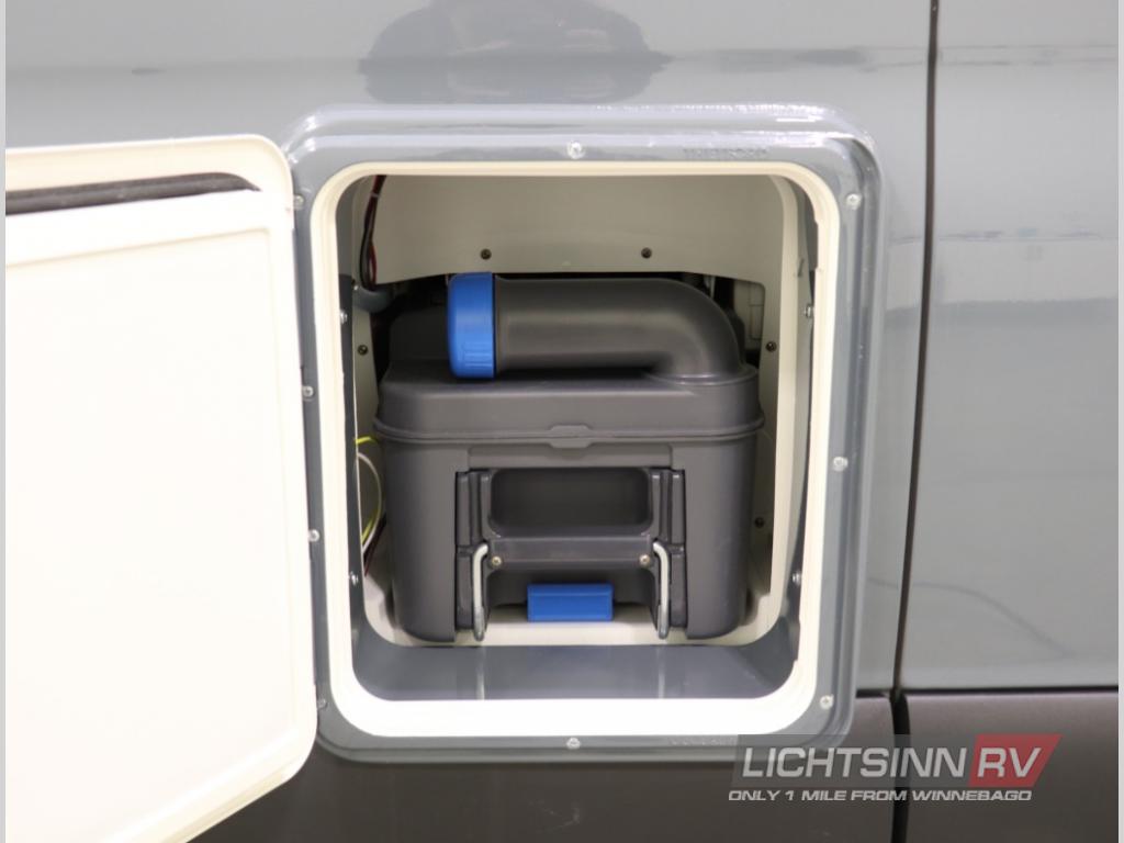 RV rental feature: External compartment with a removable grey cassette toilet waste tank, ensuring easy waste disposal.