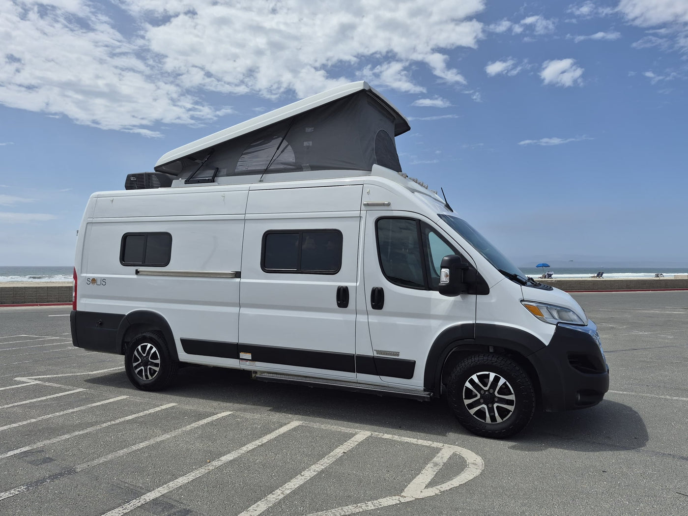  perfect for beach adventures.|Discover adventure with this white rv rental camper van — photo 12