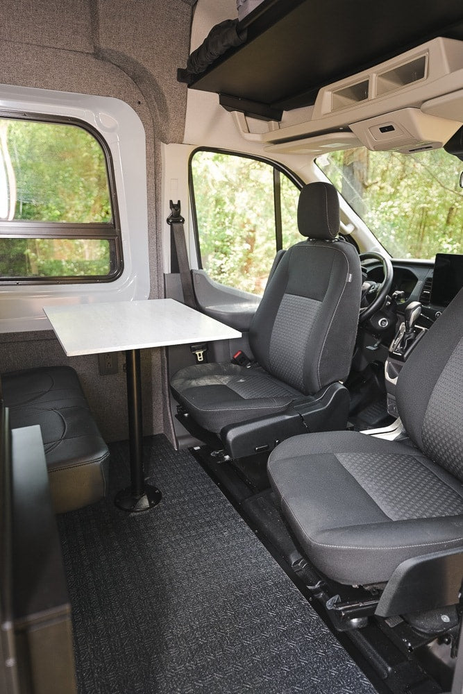  and rear passenger seats.|RV rental's front interior: two seats — photo 17