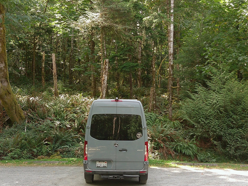  and comfy front seats.|A light gray camper van — photo 9