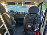 RV rental van's interior: Organized cockpit with tactical seatback storage, ladder, and safety gear, ready for adventure.