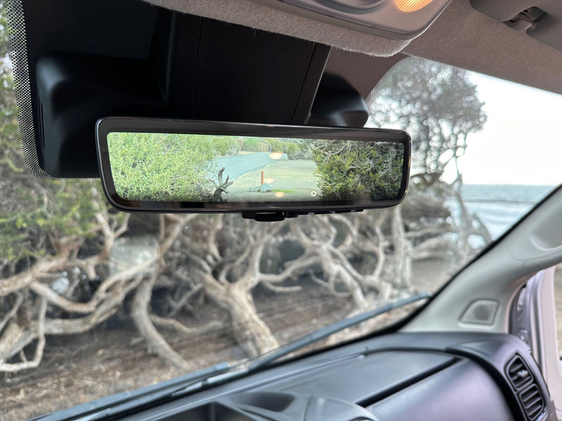  and seats with a view out the windows.|Inside a modern RV rental — photo 8