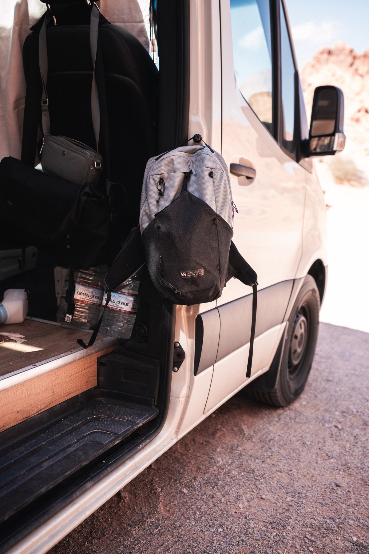 RV rental packed for the road: Gossamer Gear backpack, travel bags, and Crystal Geyser water bottles ready for exploration. — photo 4