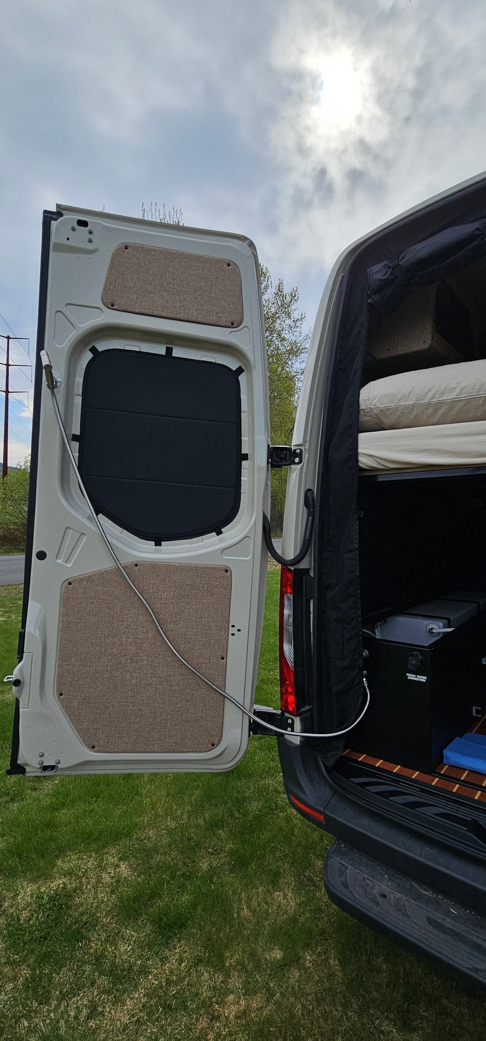  and built-in cabinets. Enjoy stunning mountain views from this camper van.|Spacious camper van interior — photo 17
